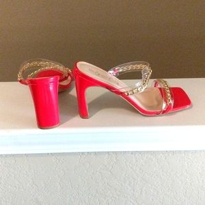 Red heels with gold chain